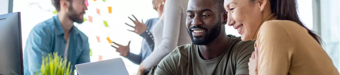 Banner image: Man and woman looking at laptop